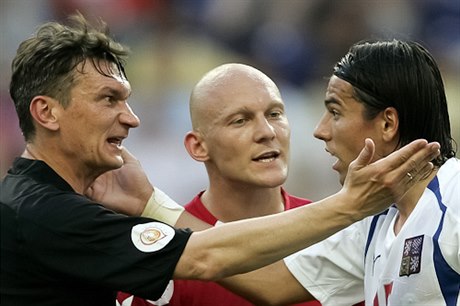 Czech striker Milan Baro (right) in a typical match argument with the referee