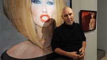 Michel Comte poses at the Leica Gallery in front of his photo of ex-fashion model Carla Bruni (now married to French President Nicolas Sarkozy), taken for Vogue Italia Michel Comte poses at the Leica Gallery in front of his photo of ex-fashion model Carla Bruni (now married to French President Nicolas Sarkozy), taken for Vogue Italia