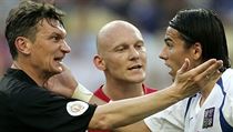 Czech striker Milan Baroš (right) in a typical match argument with the referee Czech striker Milan Baroš (right) in a typical match argument with the referee