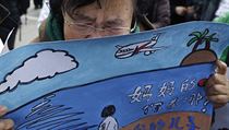 Wang Guohui, matka pasažéra letu MH370, během shromáždění v čínském Yonghegong... | na serveru Lidovky.cz | aktuální zprávy