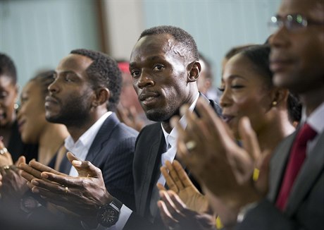 Sprinter Usain Bolt tleská projevu Baracka Obamy na University of the West...