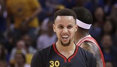 Golden State Warriors' Stephen Curry celebrates a score during the first half...