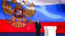 Vladimír Putin pronáší projev během videoprojekce. | na serveru Lidovky.cz | aktuální zprávy