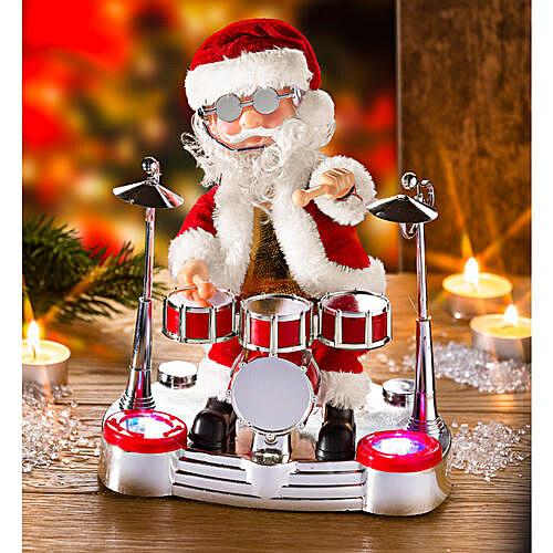 V z��i reflektor� a barevn� hudby Santa nad�en� hraje na bic� slavnou p�se� Twist.