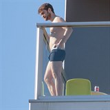 *PREMIUM EXCLUSIVE* Daniel Radcliffe shows off his abs as he puffs on a cigarette in his undies on his hotel balcony