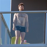 *PREMIUM EXCLUSIVE* Daniel Radcliffe shows off his abs as he puffs on a cigarette in his undies on his hotel balcony