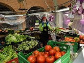 A market worker wears a mask, in Pamplona, northern Spain, Monday, March 16,...