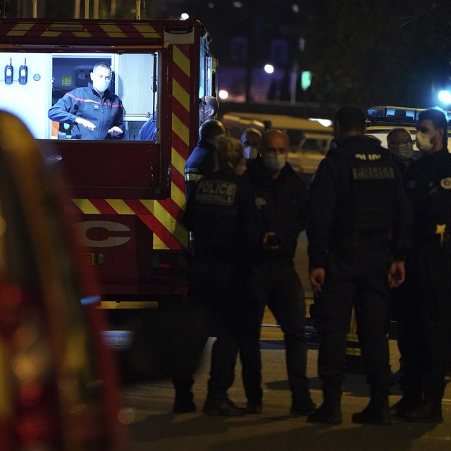 Police officers and rescue workers stand at the scene after a Greek Orthodox...