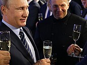 Prokremelský moderátor Vladimir Solovjov s ruským prezidentem Vladimirem Putinem