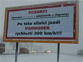 Billboard u hlavní cesty mezi Ostravou a Monovem.