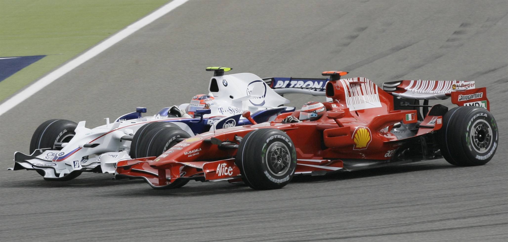 Kimi Räikkönen (vpravo), Robert  Kubica.