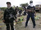 Neznámí ozbrojenci povradili na Filipínách desítky lidí a zakopali je v mlkých hrobech (24. listopadu 2009)