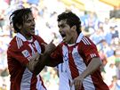 Paraguaytí fotbalisté slaví druhou branku ve slovenské síti.