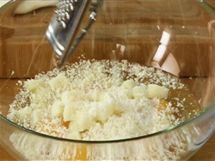 Break three eggs into a bowl, add two egg yolks, cubes of sheep's cheese and grated Parmesan cheese