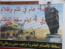 "Píval svobody povalí modly útlaku. Po 42 let represe a temnoty reim padne bhem ty dn. Vyvrácení lidské modly je náboenskou a národní povinností." Propagandistický plakát proti Kaddáfímu v ulicích Benghází. (22. února 2011)