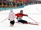 Slavný snímek Michala Riky. Kateina Neumannová s dcerou Lucií na olympijských hrách v Turín.