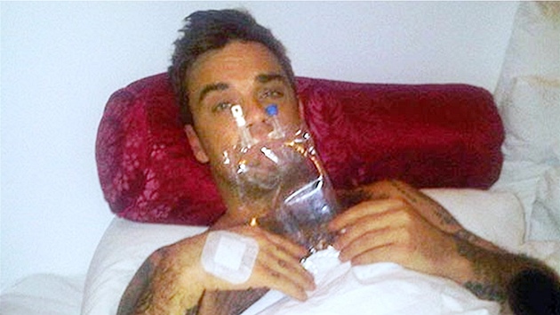 Robbie Williams se p�iotrávil jídlem