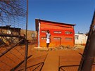 Jmashudu Mmnkheruová bydlí v oranovém dom na Thembelihle u Johannesburgu.