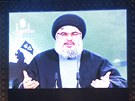 Stoupenci hnutí Hizballáh poslouchají zprostedkovaný projev Hasana Nasralláha