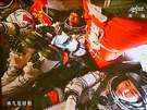 íntí astronauti ped spojením s experimentálním modulem Tchien-kung 1.