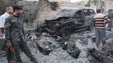 Následky atentátu v irácké Base. (14. ervence 2013)