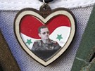 Damaek. Syrský voják s pívkem s podobiznou Baára Asada (8. záí 2013)