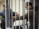 Na lavici obalovaných u soudu v Murmansku usedl i ukrajinský fotogra Denis...