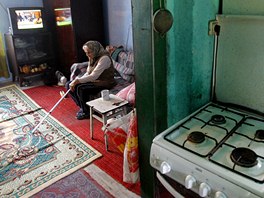 Pensioner Ioana Habianu sits in her house in Aninoasa, 330 km (202 miles) west...