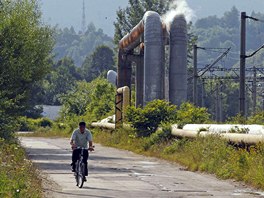 A man rides a bicycle along an empty road in Aninoasa, 330 km (202 miles) west...