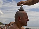 Engineer Yuri erects a stone pyramid on the head of his acquaintance and...
