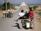 Newlyweds Tala Soboh, 14, and her 15-year-old husband Ahmed (R) ride on a...