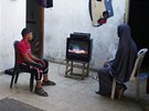 Newly married Tala Soboh, 14, and Ahmed, 15, watch a video of their wedding...