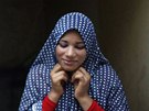 Newly married Tala Soboh, 14, dresses herself as her 15-year-old husband Ahmed...