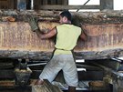 A sawmill worker processes trees illegally extracted from the Amazon jungle...