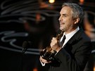 Alfonso Cuaron přebral sošku Oscara za režii filmu Gravitace (2. března 2014).