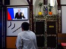 Kucha ze Simferopolu sleduje vystoupení Vladimira Putina ped ruskými poslanci...