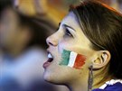 A Italian soccer fan watches a live broadcast of the World Cup match between...