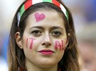 An Italy fan poses before the 2014 World Cup Group D soccer match between...