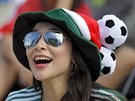 A Mexico soccer fan reacts as she watches her team's World Cup match with...