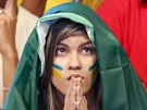 A Brazilian fan intensely watches the World Cup opening match between Brazil...