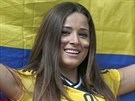 A Colombian supporter smiles as she waits for the start of the group C World...