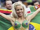 A spectator poses with her festive attire before the group A World Cup soccer...