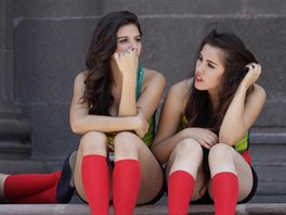 Dancers, dressed in the Mexican national flag colors, take a break as the 2014...