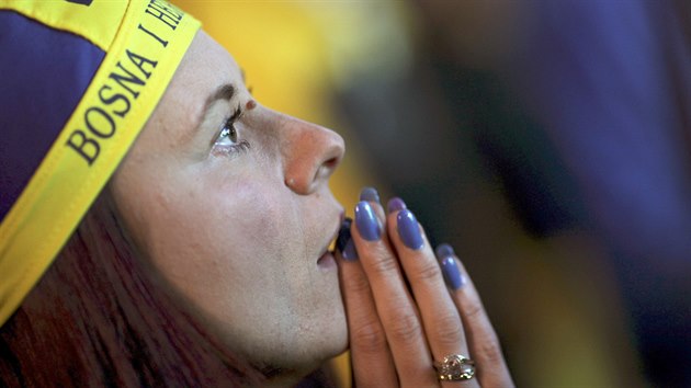 A fan of Bosnia and Herzegovina reacts after Argentina scores a goal during...