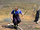 Dobrovolní hasii oistili Hladový kámen v Dín od nános. (27. ervna 2014)