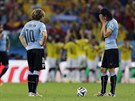 Uruguaytí fotbalisté smutn sledují kolumbijské oslavy.