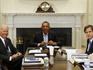 Barack Obama bhem schzky Bezpenostní rady v Roosveltov pracovn Bílého domu...
