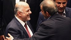 Nový premiér Iráku Hajdar Abádí s íránským velvyslancem v Iráku Hassanem...