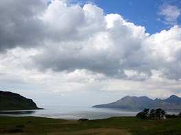 Lag Bay beach and the island of Rum (R), are seen from the island of Eigg,...