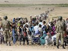 Turecko otevelo své hranice kurdským uprchlíkm, jejich vesnice v Sýrii
